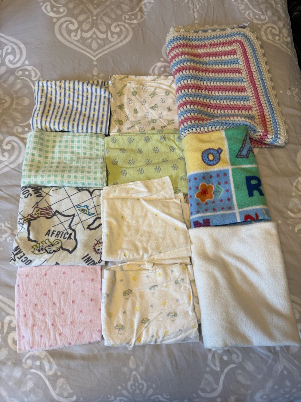Bundle of Assorted Baby Blankets Including A Knitted One